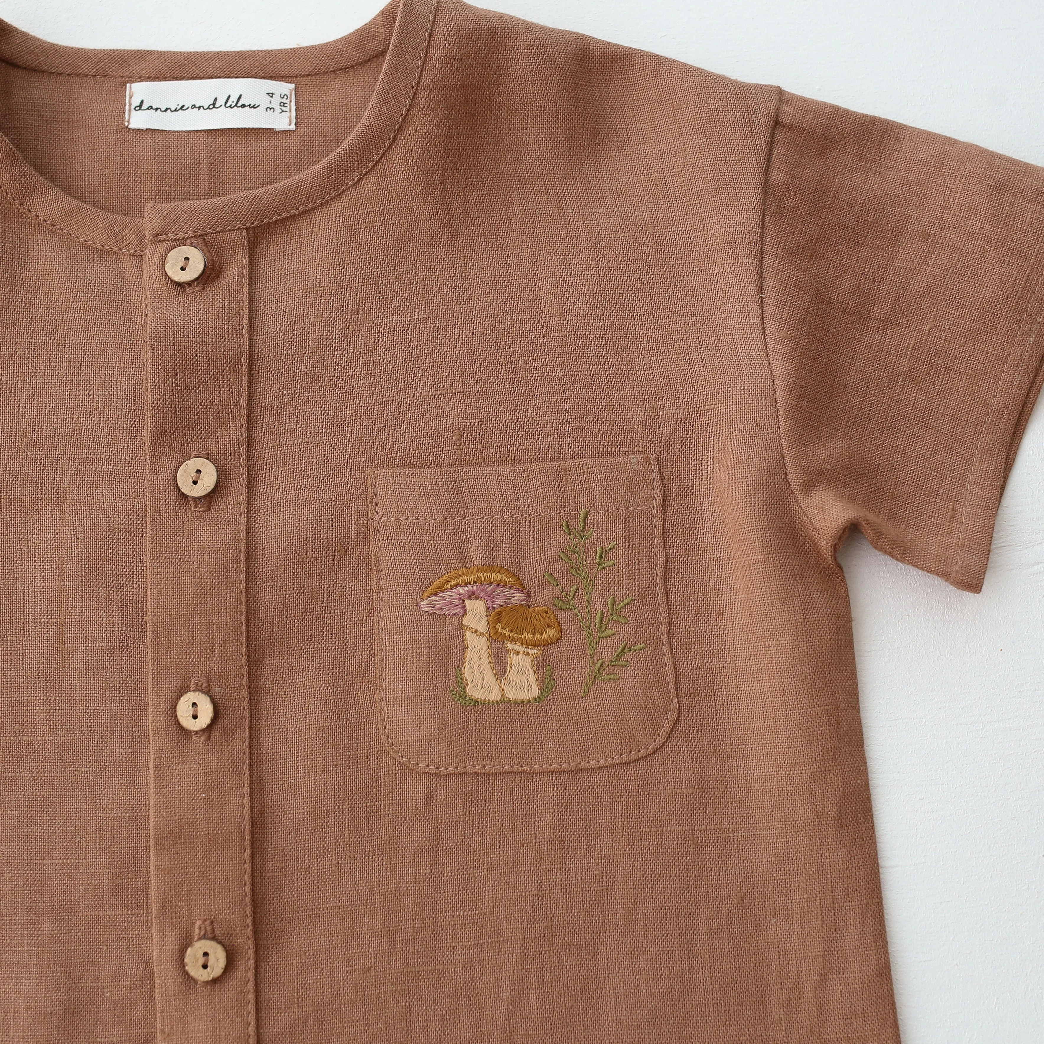 Cocoa Brown Linen Short Sleeve Buttoned Top with Curved Hemline with "Mushrooms" Embroidery